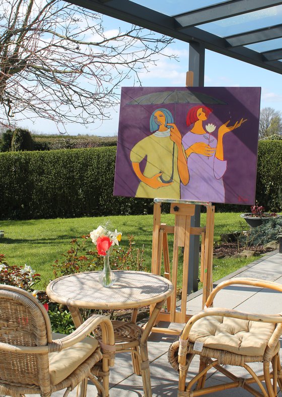 Two under an umbrella.