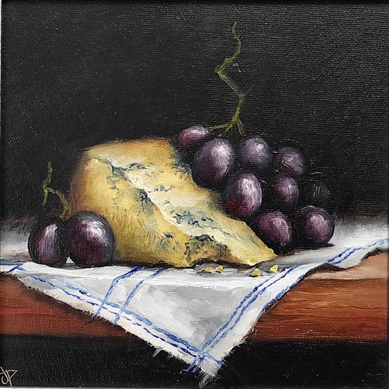 Cheese and grapes still life