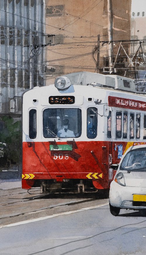 Red and White Tram in the City by Masato Watanabe