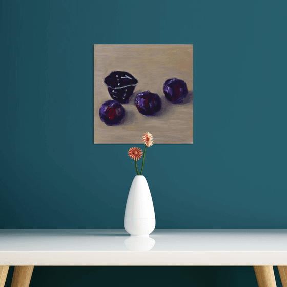 Three plums with japanese tea cup