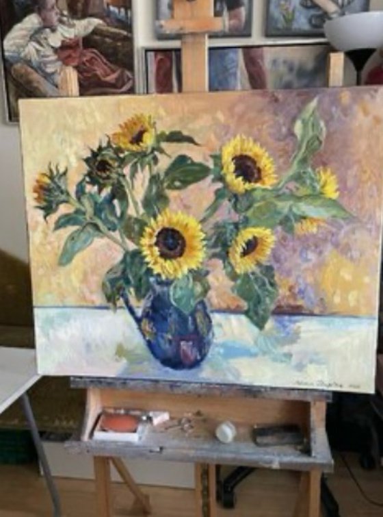 Sunflowers in a blue vase