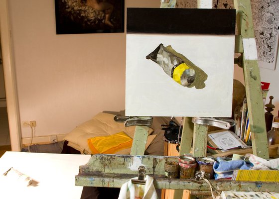 modern still life of a yellow color painting tube