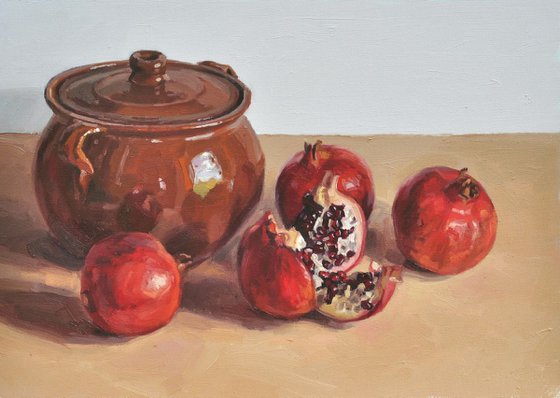 Pomegranates and an earthenware dish