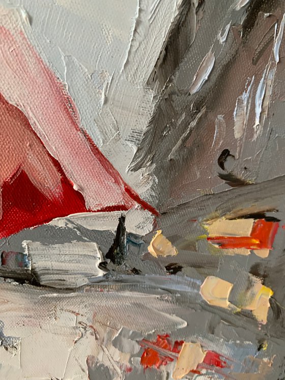 Woman with umbrella in a rainy city.