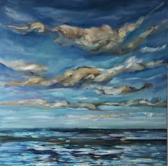 Clouds dance across the big blue sky towards the horizon - semi abstract seascape