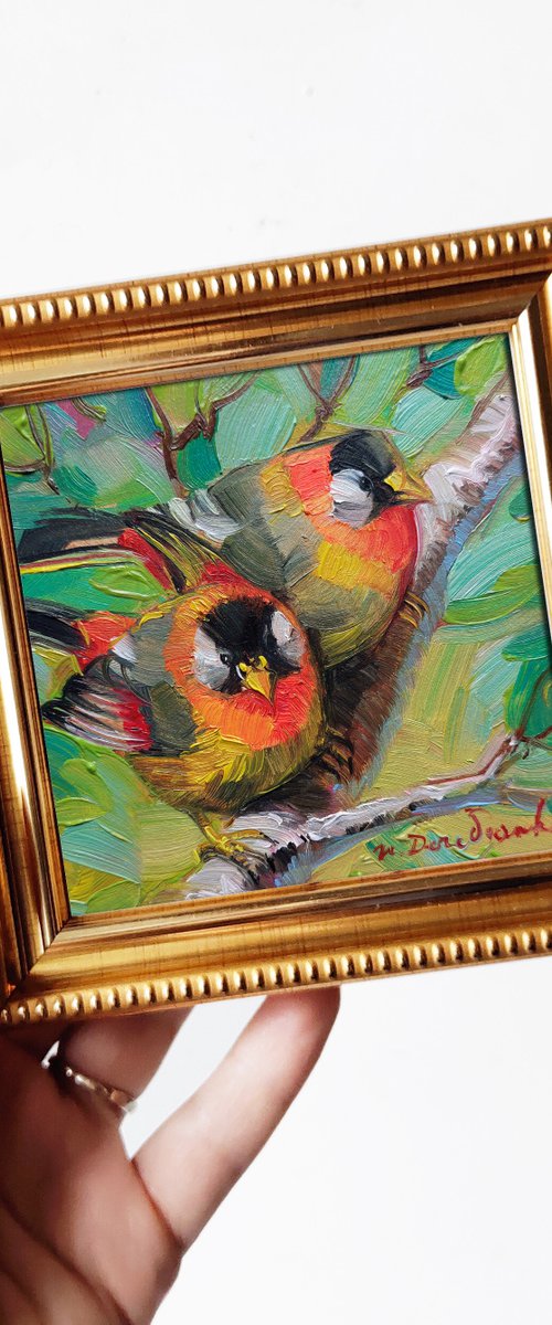 Orange birds couple on brunch by Nataly Derevyanko