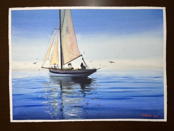 Sailboat on tranquil sea.