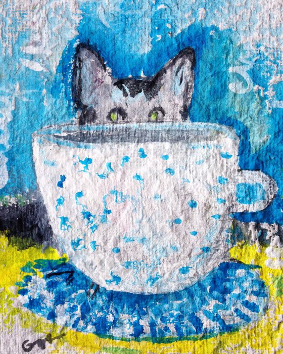 The cat with cup