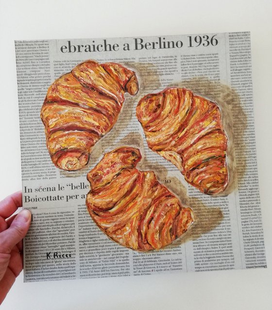 Three Croissants on Newspaper