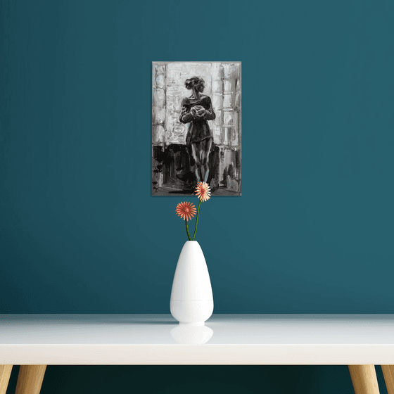 Black and white Woman with a cup of tea near the window