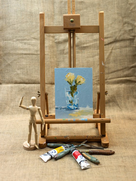 Yellow roses in glass. Still life painting with yellow roses