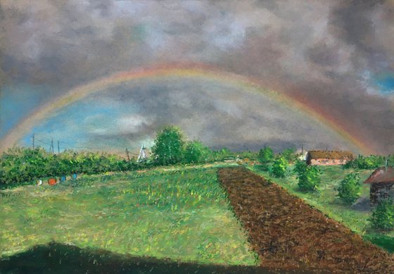 Rural landscape with a rainbow