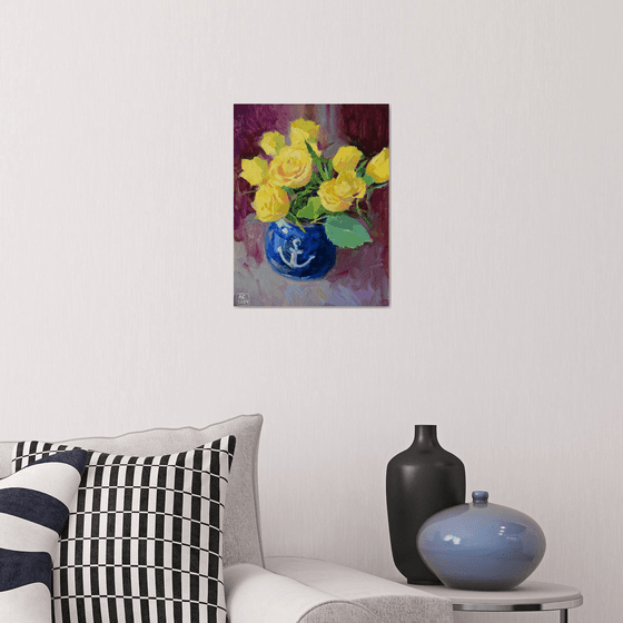 Yellow tulips in a blue vase