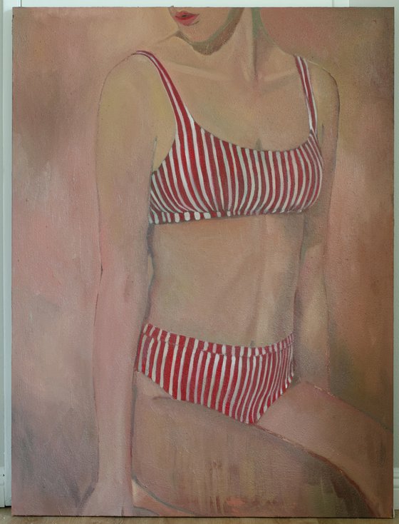 Woman in stripped swimsuit