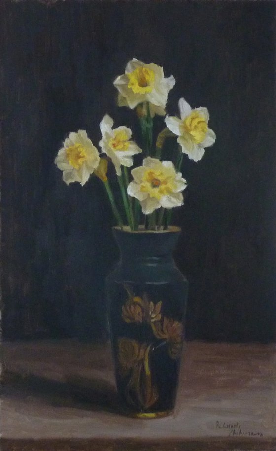 Five daffodils in a dark vase