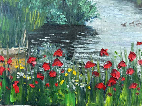 Red poppies by the water. Pleinair painting