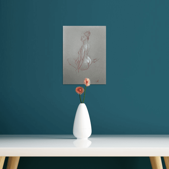 nude. back-sitting model