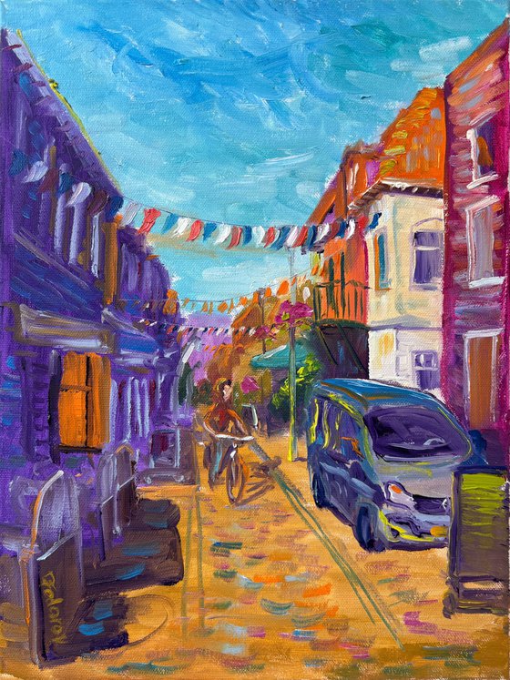 Festive Dutch town scene with cyclist