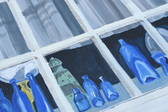 Blue bottles at the window