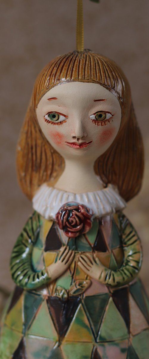 Innocent little girl with a flower. Hanging sculpture, bell doll by Elya Yalonetski by Elya Yalonetski