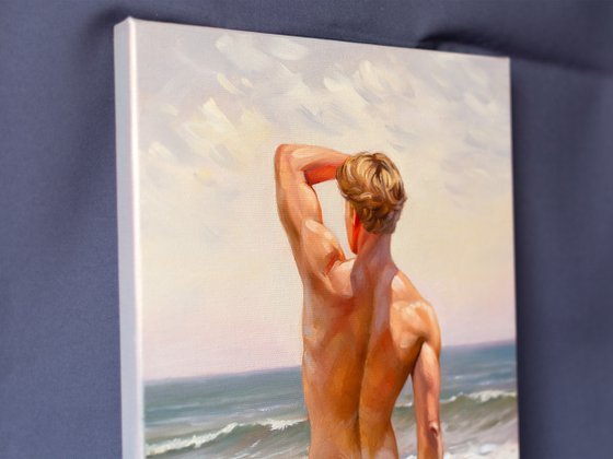 NUDE MAN BY THE SEA
