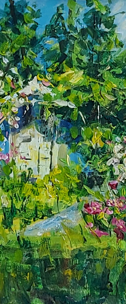 Blue house and red flowers by Dimitris Voyiazoglou