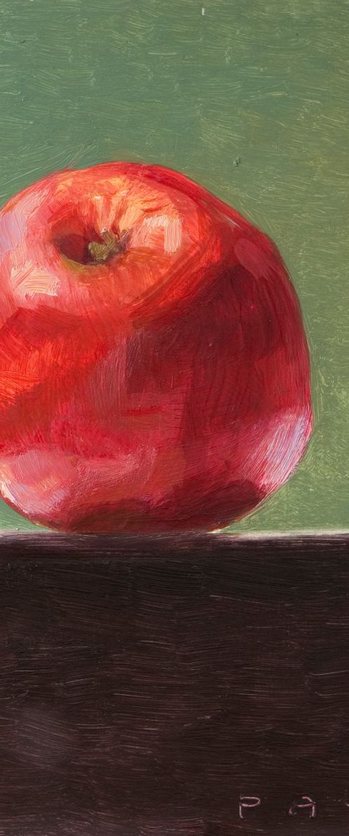 still life of fresh red apple on a green background by Olivier Payeur