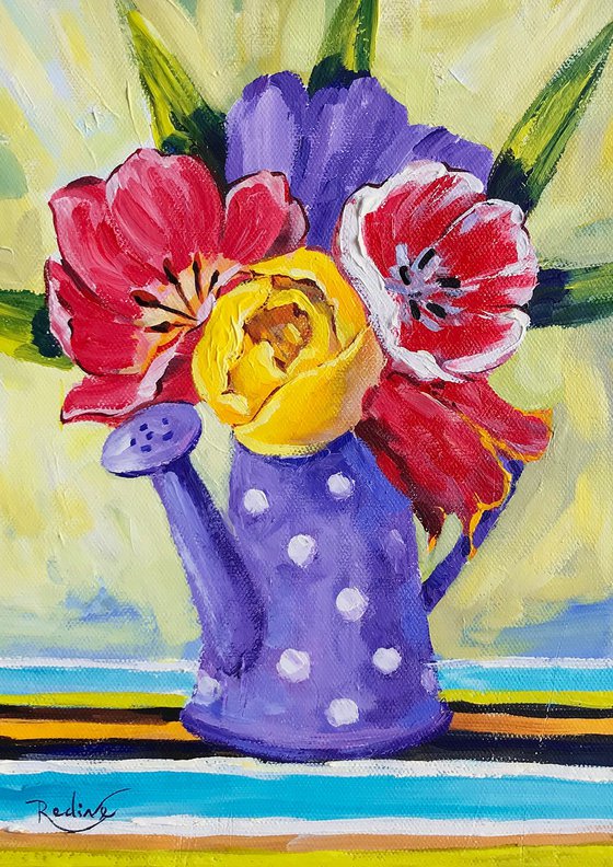 Tulips in purple watering can