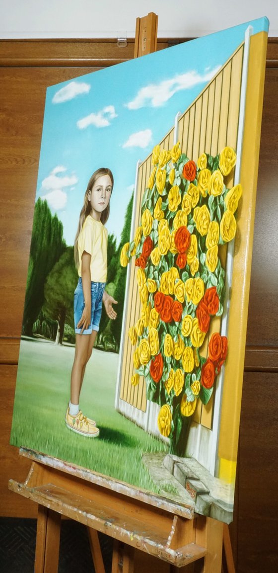 Girl showing a rose bush