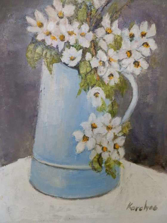 Spring flowers in a cup