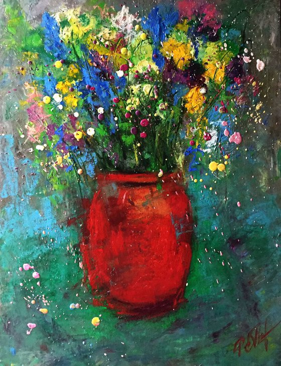 Red vase and meadow flowers