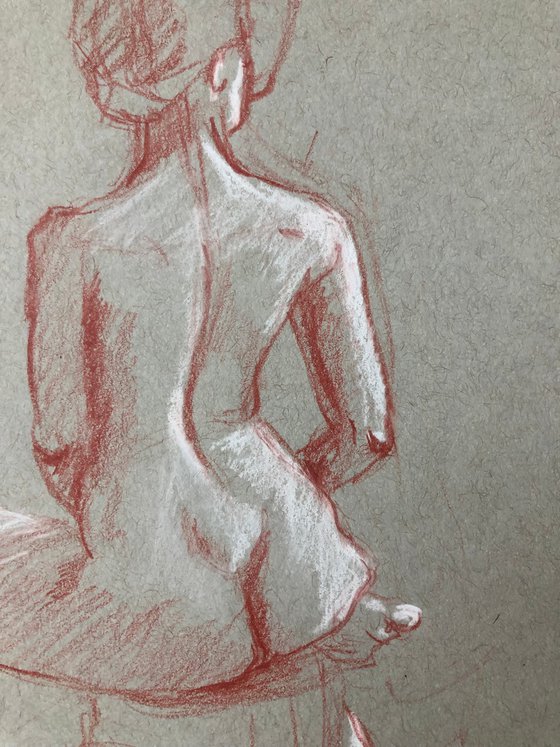 nude drawing. back-sitting model