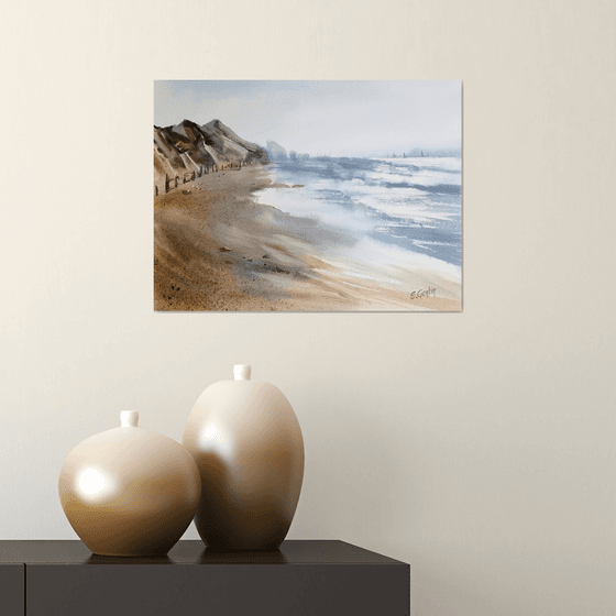 Seascape with beach and mountains