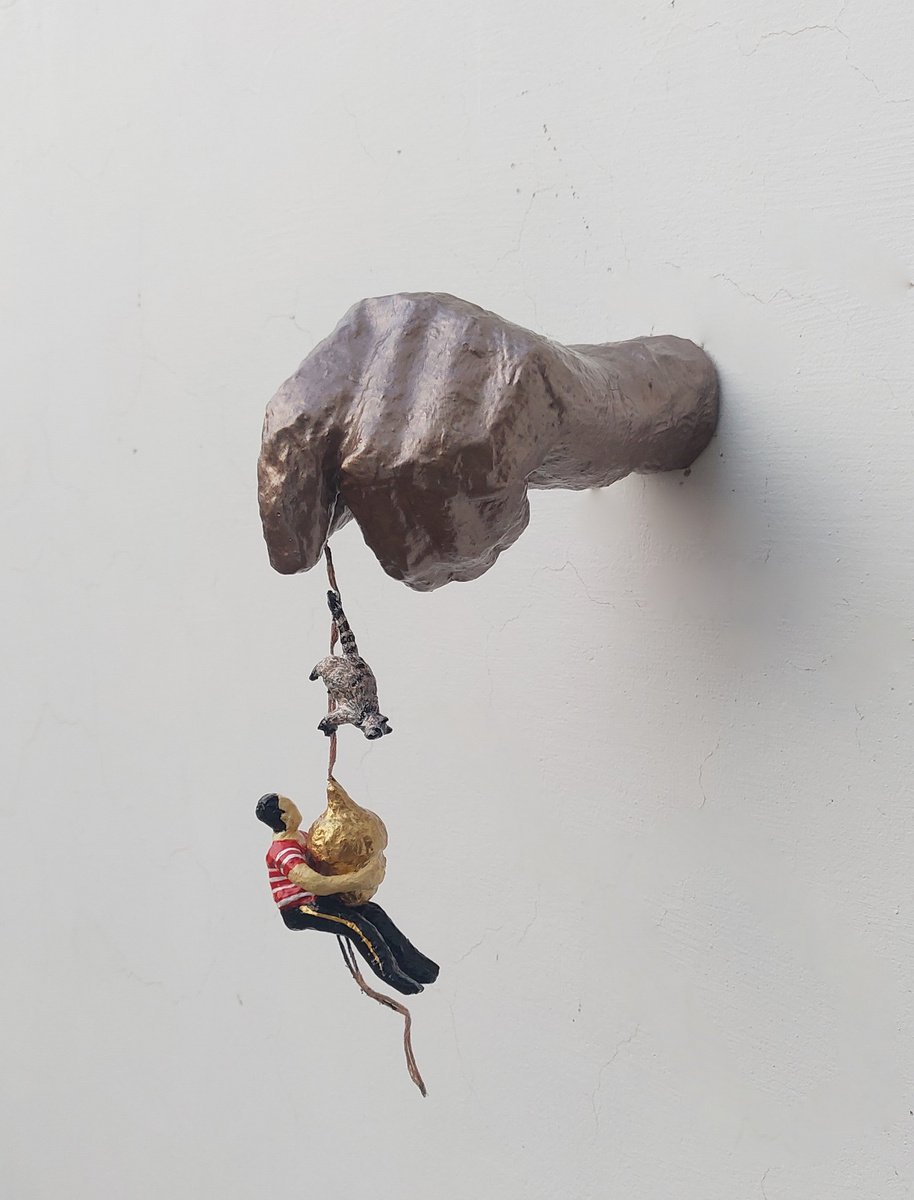 Hand holding acorn paper sculpture by Shweta Mahajan