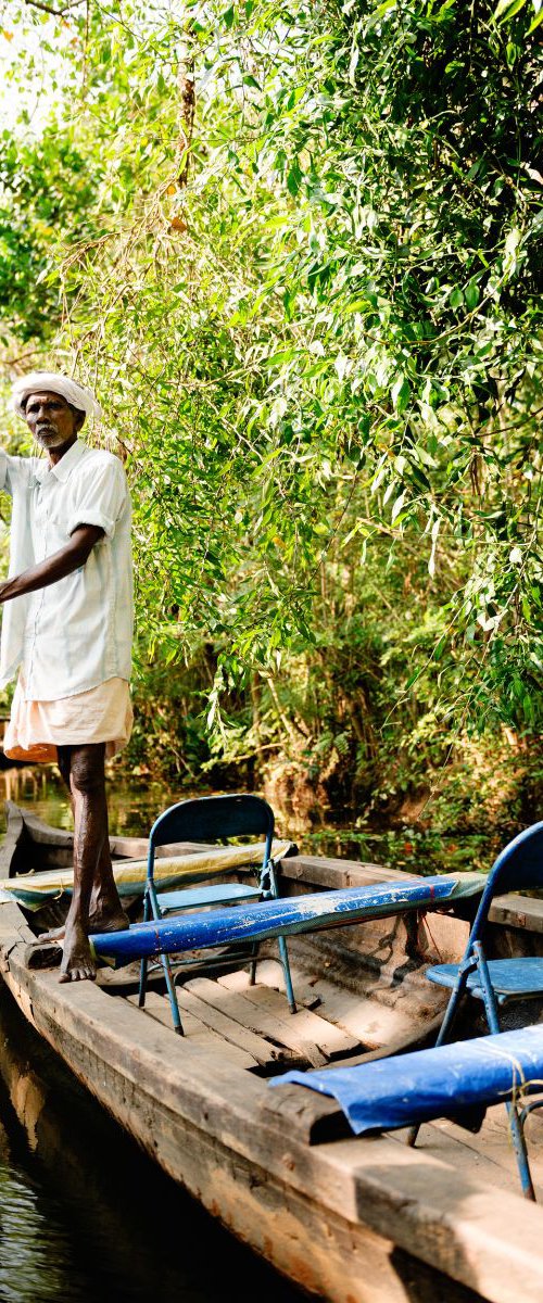 Boatman, Kerala Backwaters by Tom Hanslien