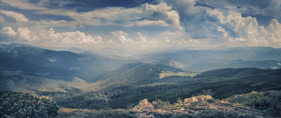 White clouds wander over the horizon.