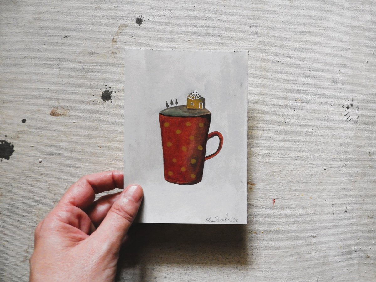 A tiny world in a red cup by Silvia Beneforti