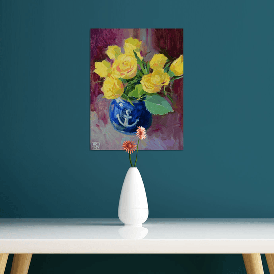 Yellow tulips in a blue vase
