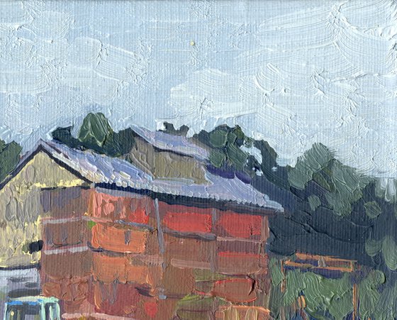 Blue tractor at the sawmill. Rodnya village