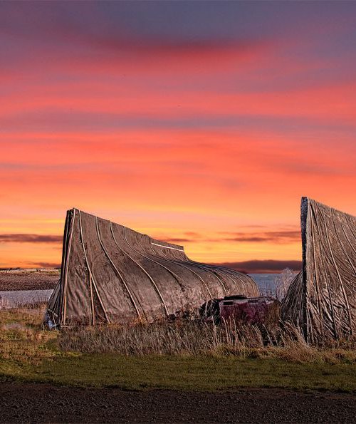 Sunrise on Holy Island by DAVID SLADE