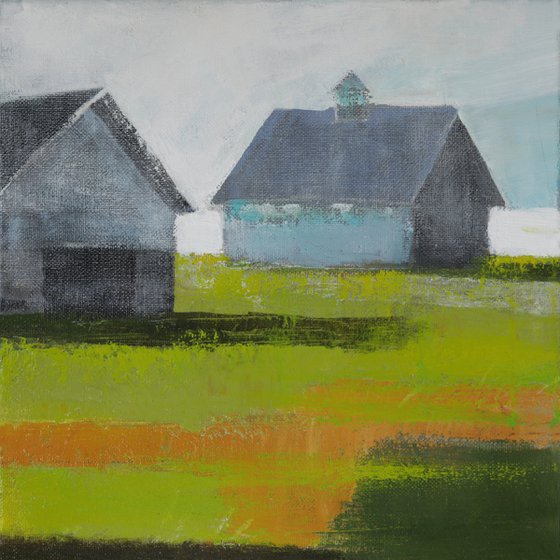 Grey barns on Green grass