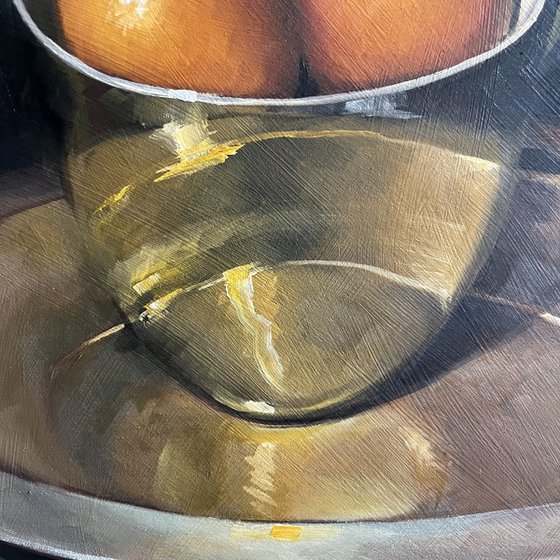 Kumquats in a gold bowl