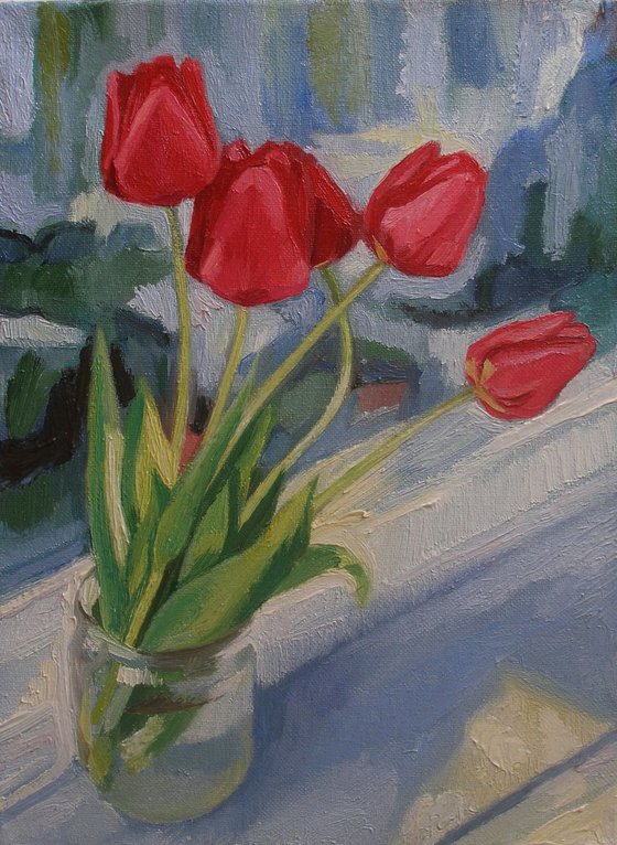 Family of tulips on the window