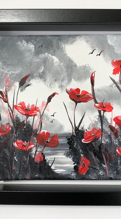 Poppies in a black frame by Marja Brown