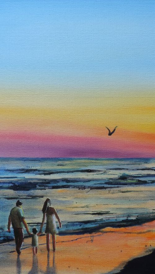 Family at the beach by Gordon Bruce
