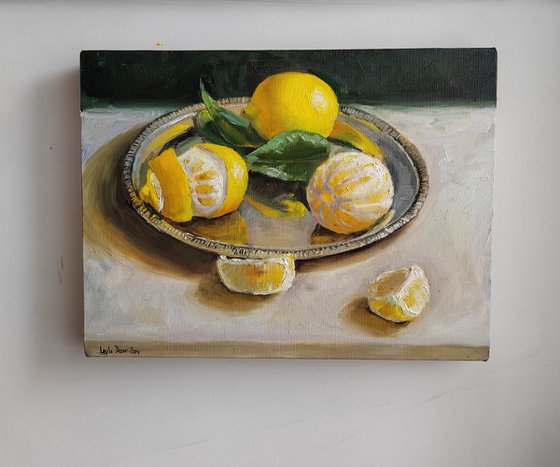 Lemon fruit slices on metal tray still life