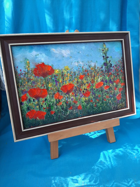 Landscape with red poppies