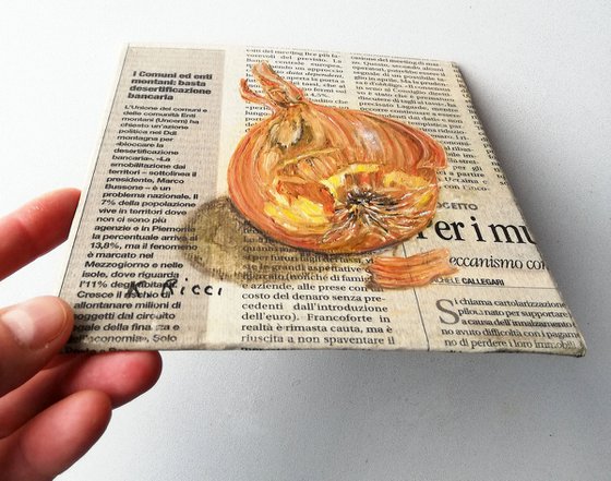 Onion on Newspaper