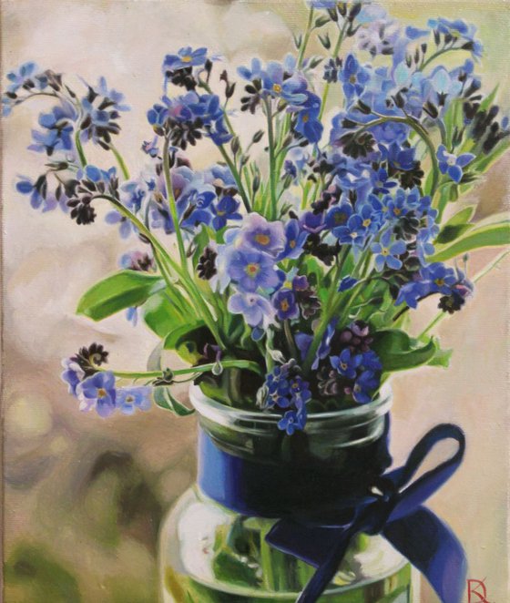 blue flowers in a jar