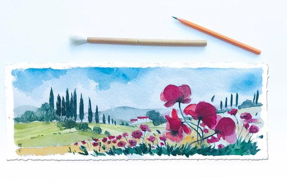 Tuscan landscape with poppies